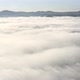 Aerial Flight Beyond Sky Over Morning Fluffy Clouds High in the Mountains - VideoHive Item for Sale