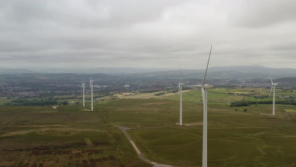A group of wind turbines on a hill