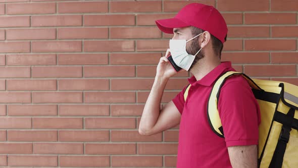 American Delivery Man Waiting and Calling Customer From the Entrance of Home to Delivery a Package