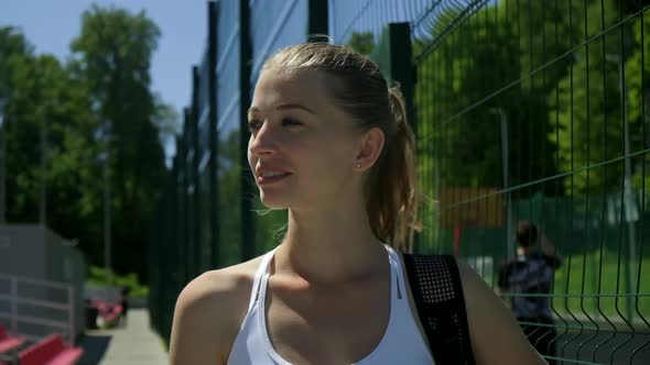 Attractive Caucasian Female in Sportswear at Sports Ground Ready for Work Out