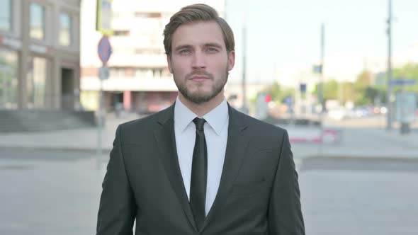 Portrait of Businessman Looking at the Camera Outdoor