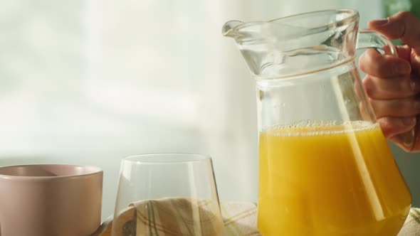 Pouring Orange Juice in Glass Closeup