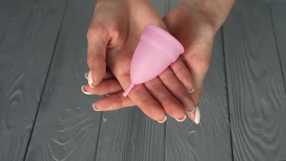Close Up Menstrual Cup Latex Silicone Girl Looking Holding Hands Compress Folding