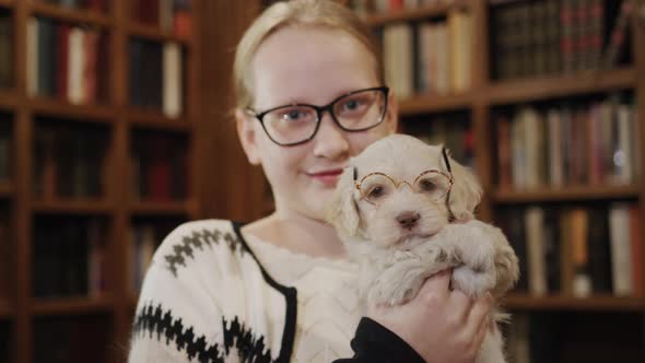 A Girl with a Pet in the Library alt