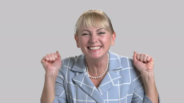 Face of Joyful Woman on Gray Background