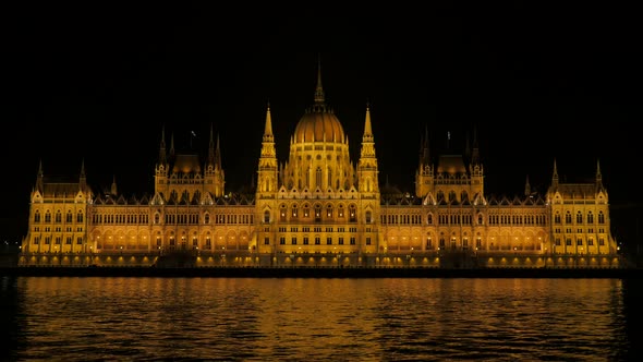 Lighted by night parliament building in Budapest Hungary 4K 2160p 30fps UltraHD video - Famous Hunga