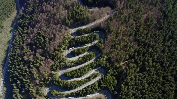 Dramatic bird's eye view of switchbacks on road over Bratocea Pass, Romania