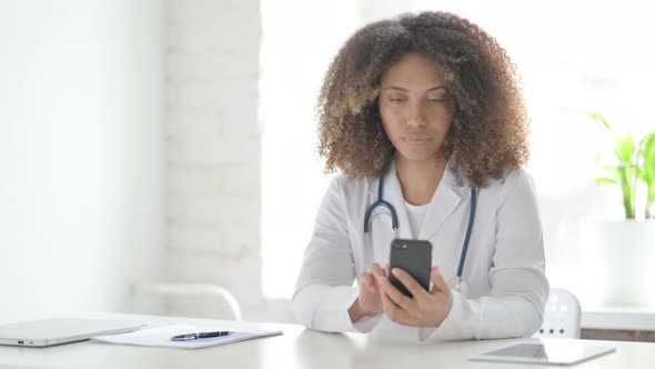 Afrcian Doctor using Smartphone in Clinic