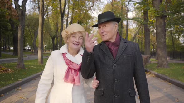 Close-up of a Mature Caucasian Couple Enjoying Autumn Day in the Park