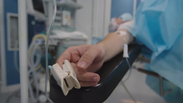 Unrecognizable Patient Making Hand Moves