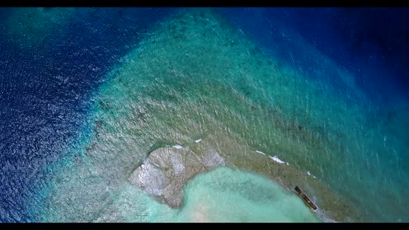 Aerial flying over tourism of luxury seashore beach voyage by blue ocean with bright sand background