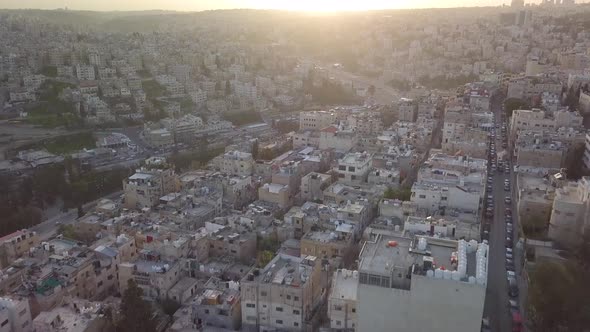 Aerial drone clip of beautiful early morning at Amman Jordan with the sun just risen over the city s