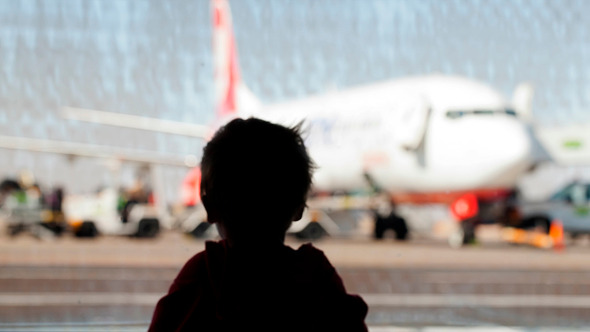 Little Boy Watching Planes At  Airport