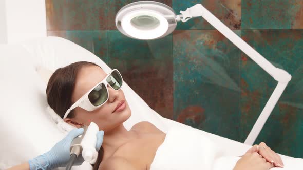 Laser Theraphy on Woman Face at Cosmetology Center