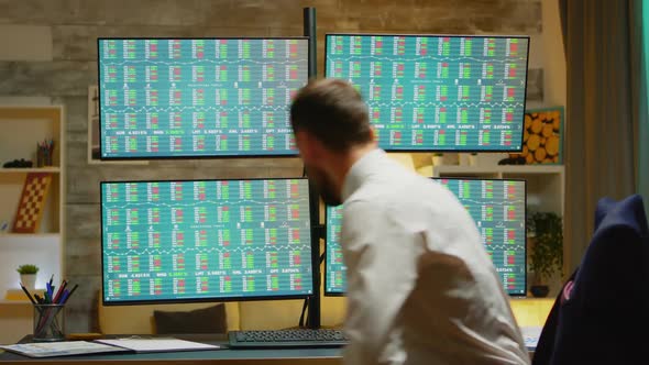 Bearded Broker in His Home Office Wearing a Suits