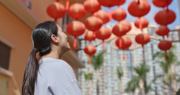 Woman look the Red lantern for chinese new year