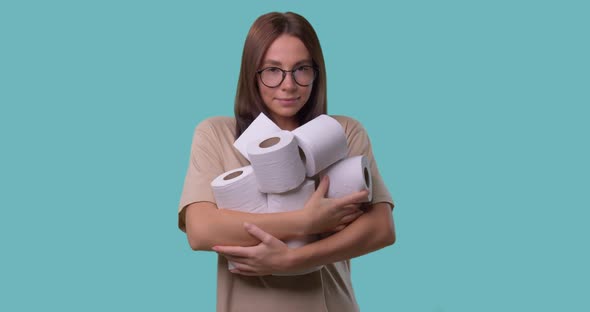 Lovely Woman Holds a Lots of Toilet Paper with Joy Face, She Happy To Hold It, Isolated Over Blue