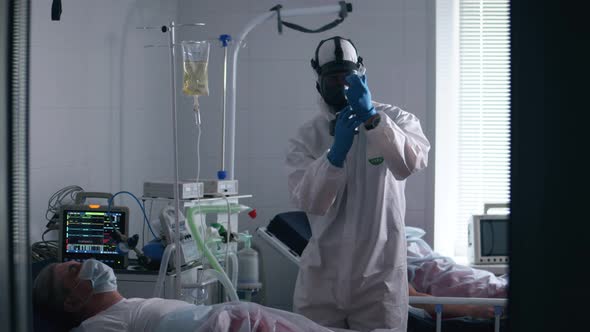 Clinic Worker Gives an Injection To a Man with Coronavirus.