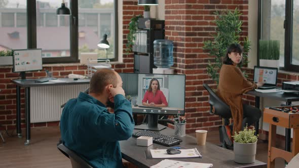 Entrepreneur Using Earpods to Talk to Manager on Video Call