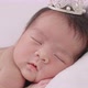 Slow Motion Shot Of Cute Newborn Baby Sleeps Wearing A Gold Crown. - VideoHive Item for Sale