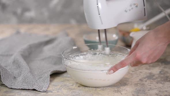 Electric Mixer Whipping Cream in Mixing Bowl, Making Cream Dessert