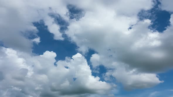 Summer Clouds background.Blue sky white clouds.Cloudscape timelapse