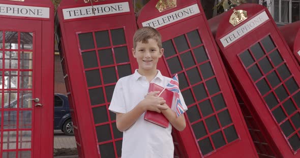 Slow Motion Portrait of Cute Boy Standing Outdoors Alone Smiling Looking at Camera
