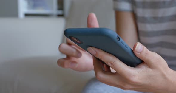 Woman use of mobile phone at home