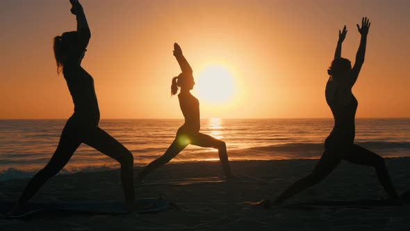 Group Of Women Practicing Yoga