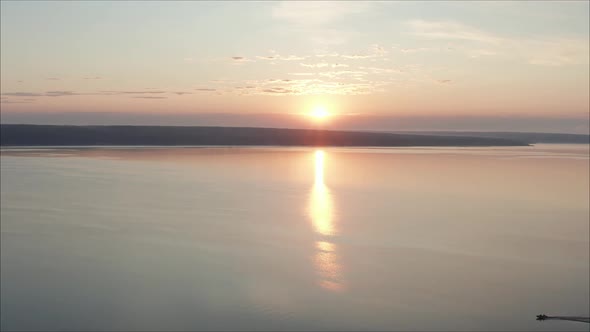 Beautiful, Bright Sunrise Over the Lake. Sunset Over the Drone Reservoir Frames