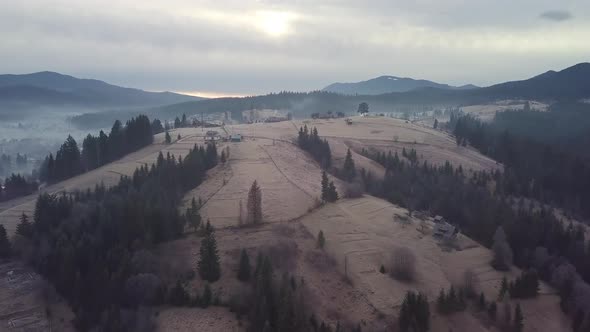 Flight Over the Village in the Carpathian Mountains