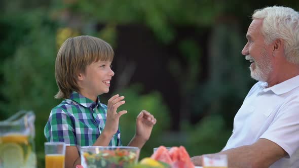 Kid Laughing With Grandpa Telling Funny Stories, Family Having Fun Together