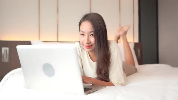 Young asian woman use laptop