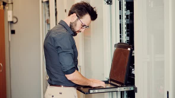 It Administrator In Mining Server Room And Connecting Ethernet Wire. Internet Network Switch.