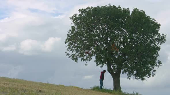 Guy Peeing in Park, Young Man Urinating on Tree, Human Influence on Ecology