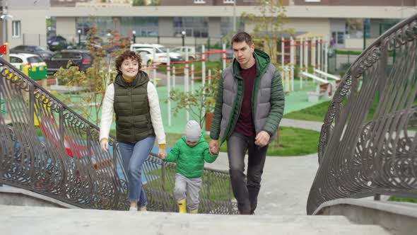 Young Urban Family Returning from Playground