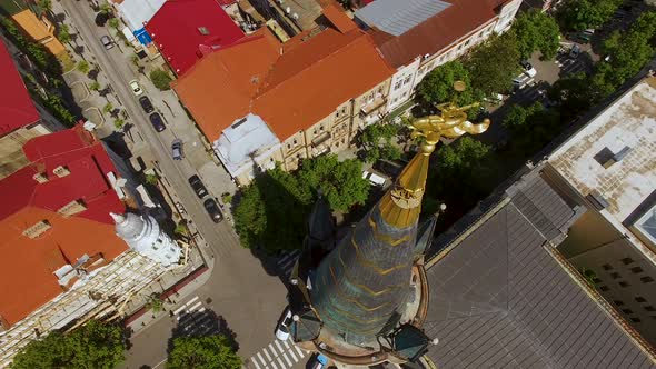 Weathervane of Astronomical Clock Tower in Batumi Against Cityscape, Sea at Back