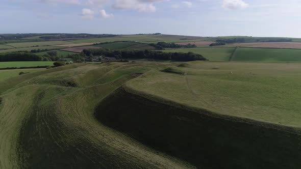 Aerial of the eastern gate of the iron age hill fort, Maiden Castle. Fields in the surrounding lands