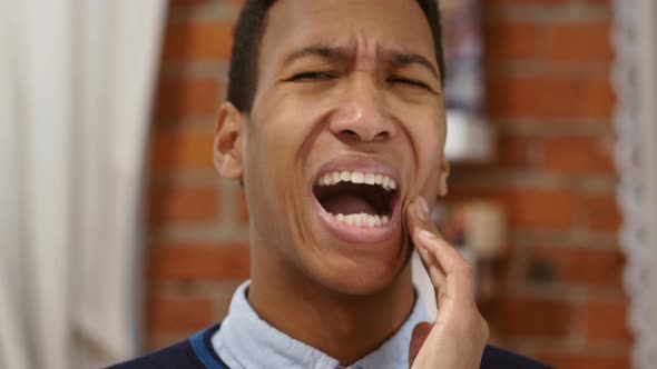 Frustrated African Man Suffering Teeth Pain, Toothache