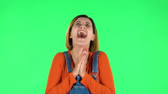 Girl Communicates with Someone in a Friendly Manner. Green Screen