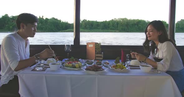 Couple Eating Food On Boat With Good View