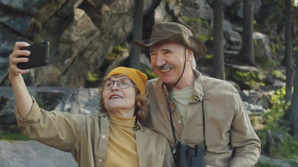 Happy Senior Couple Taking Selfie in Nature