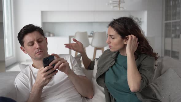 Irritated Husband Hides Message in Phone Not Wanting to Show