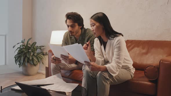 Colleagues Discussing Business on Couch