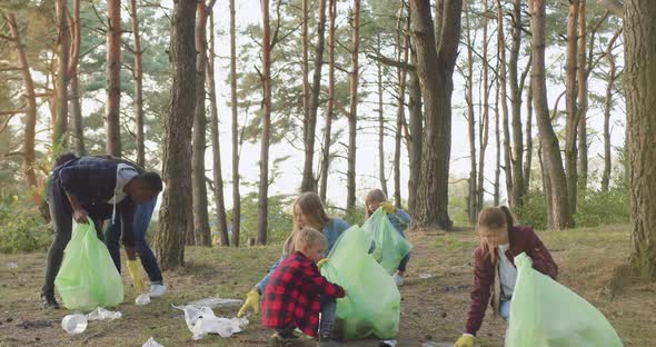 Volunteers from Unit of Nature Lovers Cleaning Trash in the Park or Forest