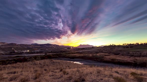 Sunrise time lapse with stunning colors and a dynamic cloudscape over Lehi, Utah