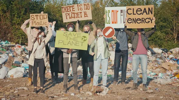 Attractive Young Woman Activist With a Poster Calling to Stop Plastic