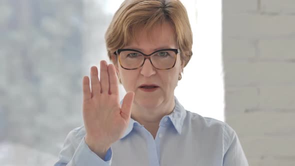 Stop Gesture By Old Businesswoman Denying Offer