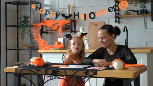 Girl with Mother Playing Halloween TicTacToe