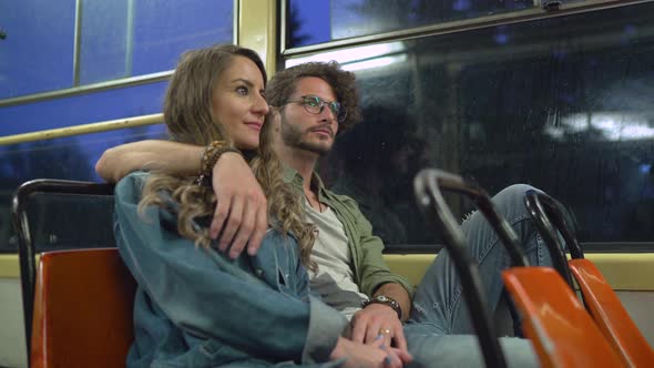 Couple sitting on the tram